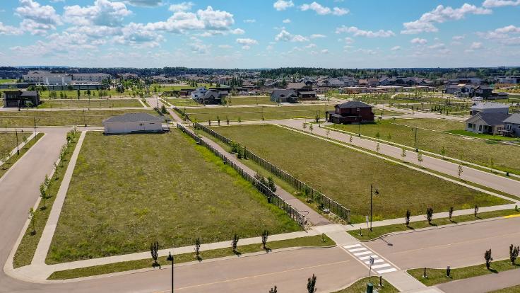 Aerial photos of Timberlands North showing large green spaces and a pathway